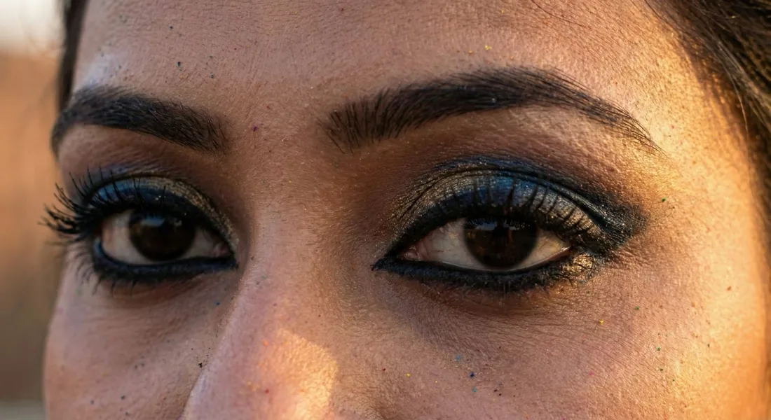 Close-up of dramatic waterproof eye makeup with bold kajal and jewel-toned eyeshadow
