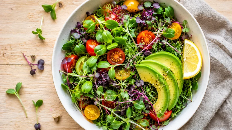 Fresh salad bowl topped with sunflower, radish, and broccoli microgreens