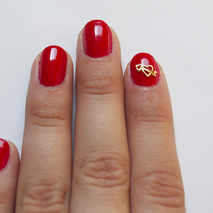 An easier alternative to free-hand nail art: Hex’s gold-plated nail charms start at $1.50 each.